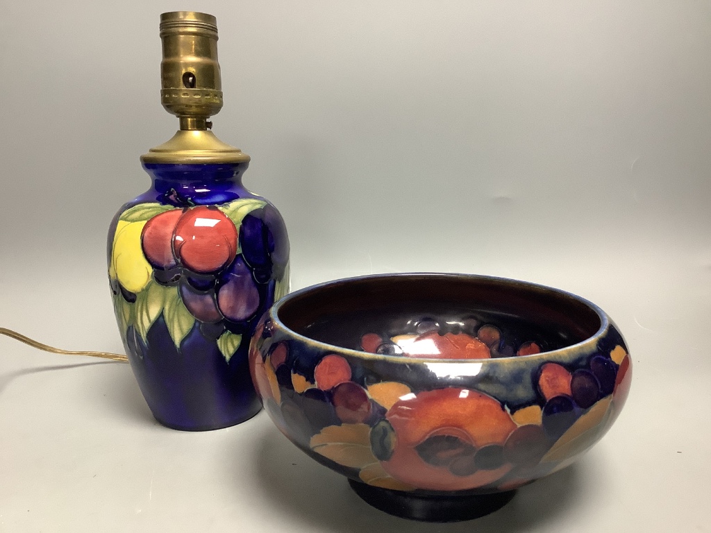 A small Moorcroft wisteria pattern table lamp base, height 16.5cm not including light fitting, and a Moorcroft Pomegranate pattern bowl